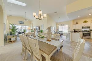 a dining room and kitchen with a table and chairs at Tuscan Pines Villa in Davenport