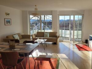 a living room with a couch and a table at Traumblick in Kempten