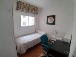 Postel nebo postele na pokoji v ubytování Plaza PUERTA NUEVA