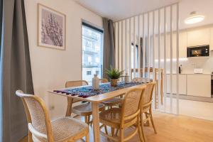 a dining room with a table and chairs at Campolide Lovely 2 bedroom by Innkeeper in Lisbon