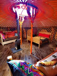 a room with a gazebo with a red ceiling at The Yurt in Newton Stewart