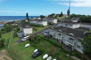 an aerial view of a house with cars parked in a yard at Dadda's Place 2 in Port Shepstone