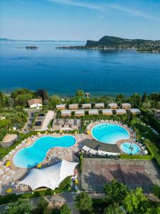 an aerial view of a resort with two swimming pools at Campeggio Europa Silvella in San Felice del Benaco