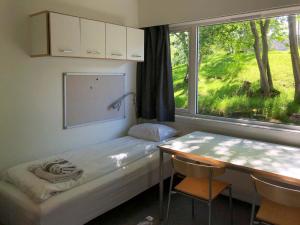 Postel nebo postele na pokoji v ubytování Sund sommerhotell, Inderøy