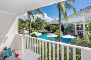 a view of the pool from the balcony of a resort at Sugar Bay Barbados - All Inclusive in Bridgetown