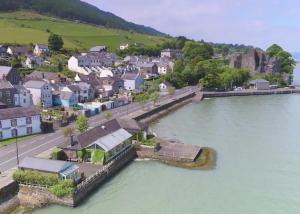 an aerial view of a small town next to a river at The Baby House @ Wood Quay, Carlingford in Carlingford
