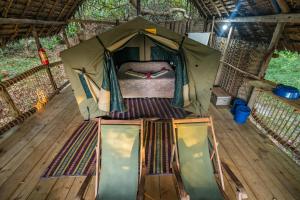 a tent with a bed inside of it at Kitu Kiblu in Baleni
