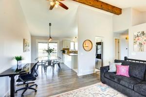 a living room with a couch and a table at Pet-Friendly Omaha Vacation Rental with Deck! in Omaha