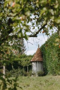 a small house in the middle of a field at Les Manoirs des Portes de Deauville - Small Luxury Hotel Of The World in Deauville