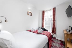 Letto o letti in una camera di SMITH PLACE HOTEL