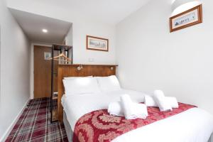Letto o letti in una camera di SMITH PLACE HOTEL