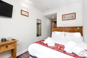 Letto o letti in una camera di SMITH PLACE HOTEL