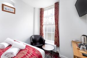 Letto o letti in una camera di SMITH PLACE HOTEL