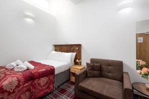Letto o letti in una camera di SMITH PLACE HOTEL