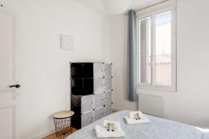 Postel nebo postele na pokoji v ubytování Charming flat near the centre of Toulon - Welkeys