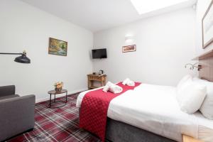 Letto o letti in una camera di SMITH PLACE HOTEL