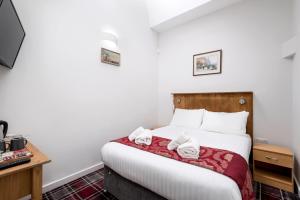 Letto o letti in una camera di SMITH PLACE HOTEL