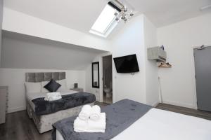 Postel nebo postele na pokoji v ubytování Hotel Anfield