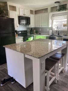 a kitchen with a island in the middle of a counter at Sweet retreat in the springs NOT waterfront property in Homosassa