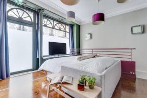 Postel nebo postele na pokoji v ubytování Appartement Gambetta - Atypique - Rue Calme - Quartier dynamique