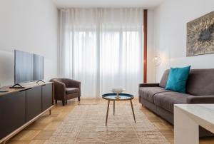 Телевизор и/или развлекательный центр в Milan Retreats
