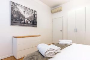 Кровать или кровати в номере Milan Retreats +37 фотографий