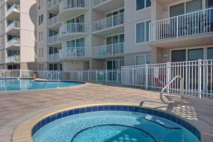 a swimming pool in front of a apartment building at Island Princess 710 in Fort Walton Beach