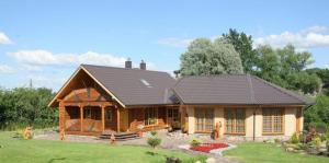 a large house with a gambrel roof at Šeduvos malūnas in Šiauliai