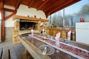 a kitchen with a fireplace and a table with candles at Apartments Jozic in Trogir
