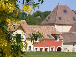 a house in a village with a roof at Les Belleme Golf - Self-catering Apartments in Bellême +27 photos