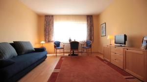 Μια τηλεόραση ή/και κέντρο ψυχαγωγίας στο Friends Hotel Kerpen