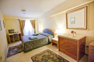 Postel nebo postele na pokoji v ubytování Hotel Elimo