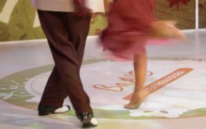 a couple of people dancing on a dance floor at Posada de Amonaria in Malpartida de Plasencia