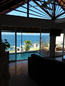 a view of the ocean from a house at Nusa Lembongan Villa Shambala in Nusa Lembongan