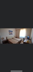 מיטה או מיטות בחדר ב-residence afrodite