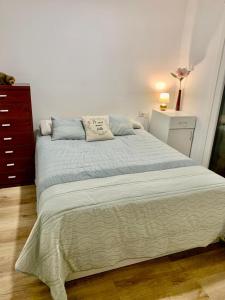 a large bed in a bedroom with a dresser at Playa monte y mar, casa a 5 minutos del mar in Ondárroa