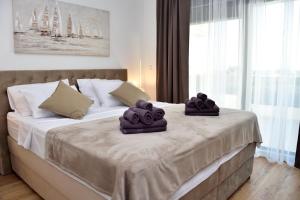 a bedroom with a bed with towels on it at VILLA PAOLA in Polača +40 photos