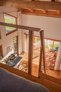 a view of a living room with a view of a house at Myra Canyon Lodge in Kelowna