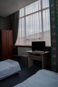 Postelja oz. postelje v sobi nastanitve HOTEL SV