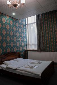 Postelja oz. postelje v sobi nastanitve HOTEL SV