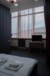 Postelja oz. postelje v sobi nastanitve HOTEL SV