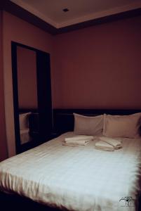 Postelja oz. postelje v sobi nastanitve HOTEL SV