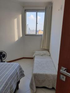 Кровать или кровати в номере Apartamento em Guarapari