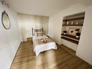 Postel nebo postele na pokoji v ubytování Casa Eloisita