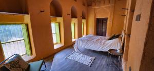 Postel nebo postele na pokoji v ubytování Bait Al Aali Guesthouse