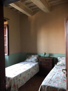 Ένα ή περισσότερα κρεβάτια σε δωμάτιο στο Casa Amiata
