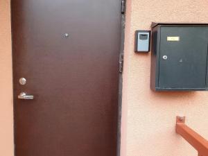 a door to a building with a mailbox next to it at Liepu 37 in Klaipėda