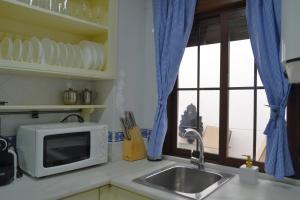 Kuchyňa alebo kuchynka v ubytovaní SunShine Patio del Consistorio + 5 fotografií