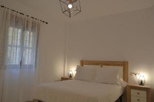 Posteľ alebo postele v izbe v ubytovaní SunShine Patio del Consistorio