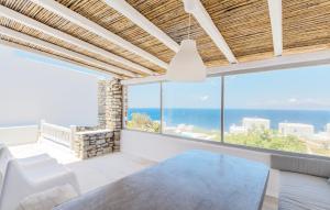 a living room with a view of the ocean at Villa Phaedra by Whitelist Mykonos in Agios Ioannis Mykonos